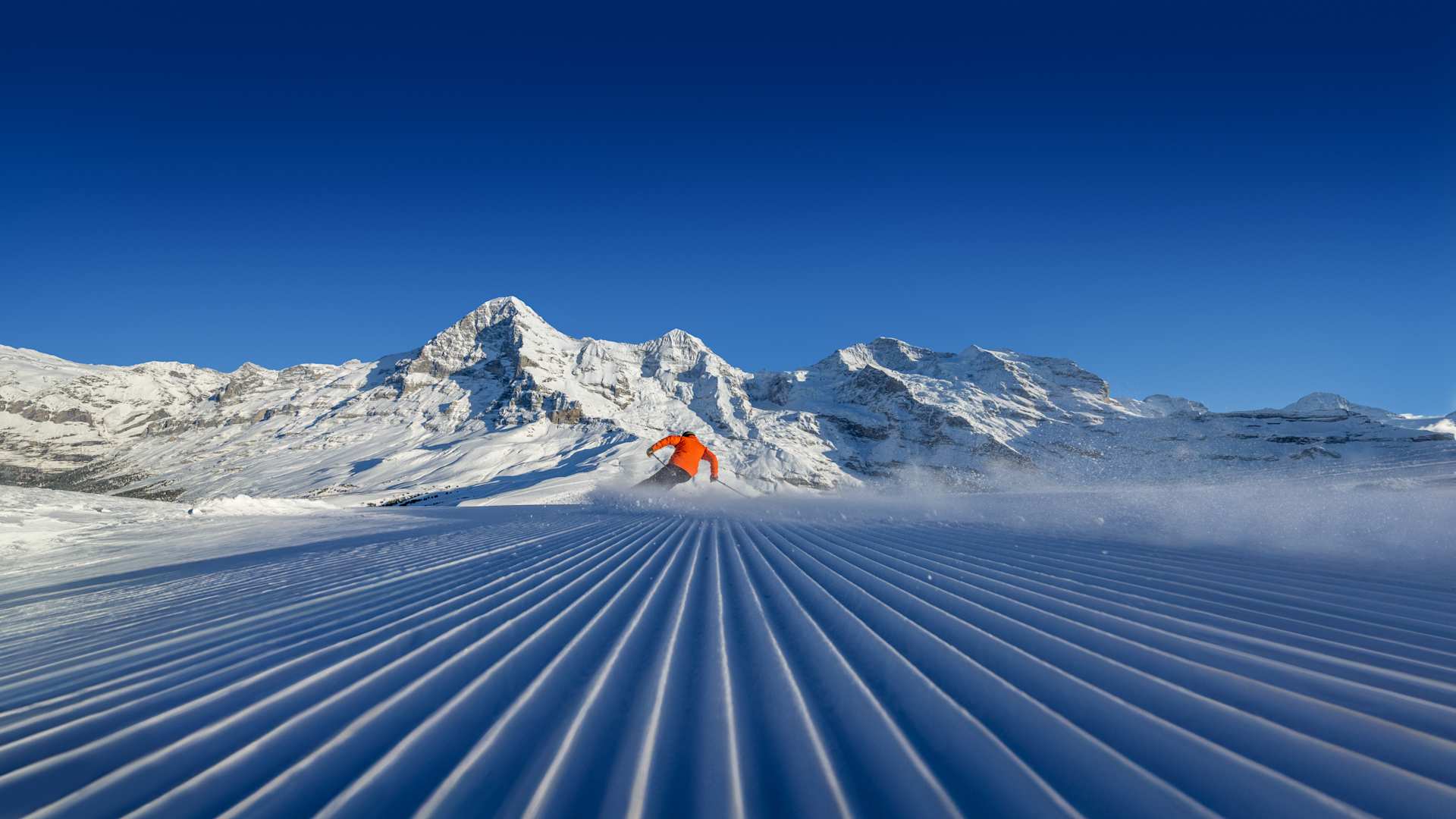 Skiers at Kleine Scheidegg in front of Eiger, Mönch and Jungfrau
