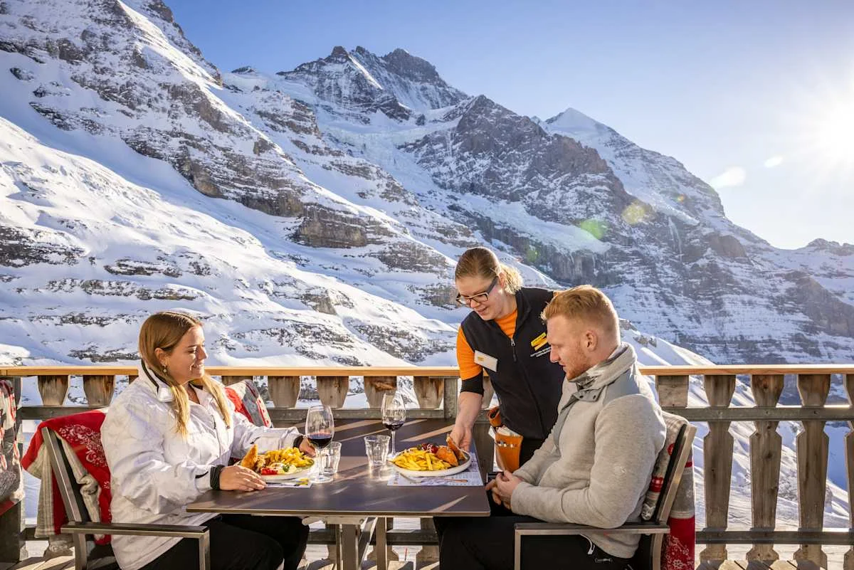 Guests being served on the terrace of Restaurant Eigergletscher