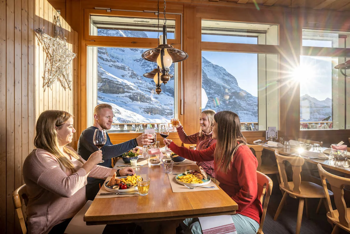 Four people toasting at Restaurant Eigergletscher
