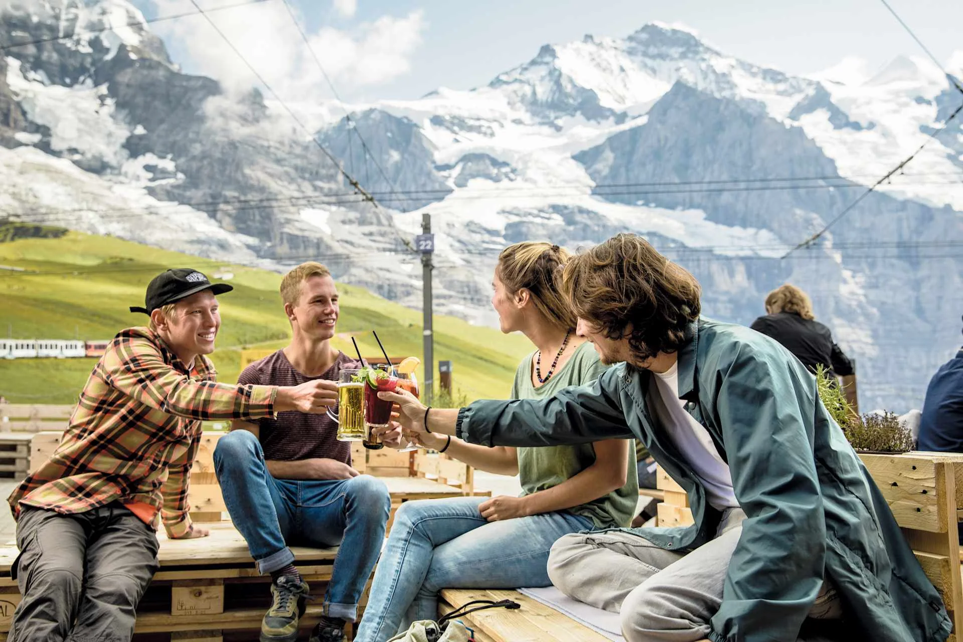 Mountain Restaurant Kleine Scheidegg, 4 people with drinks.