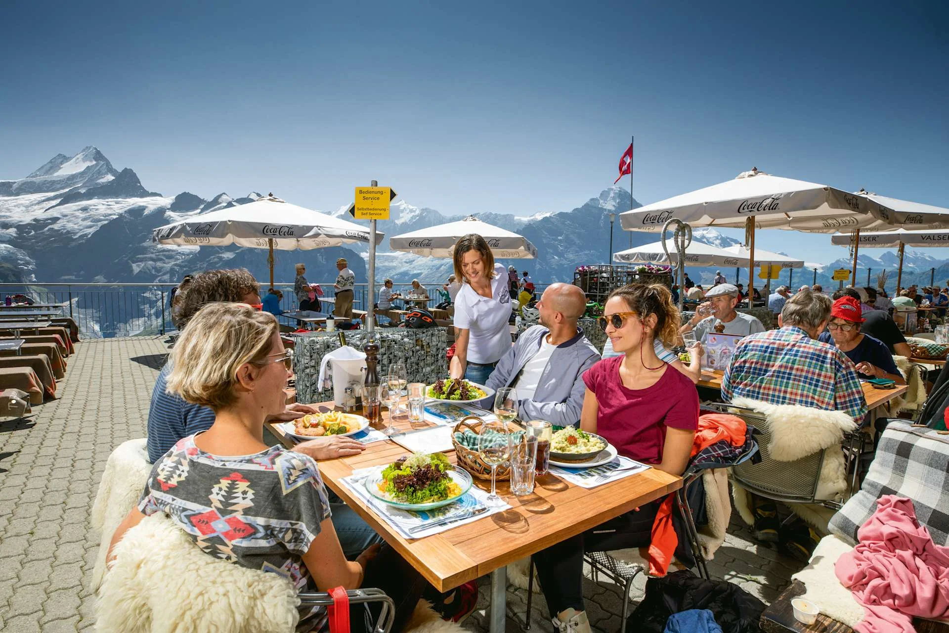 First Mountain Restaurant, 4 people with food.